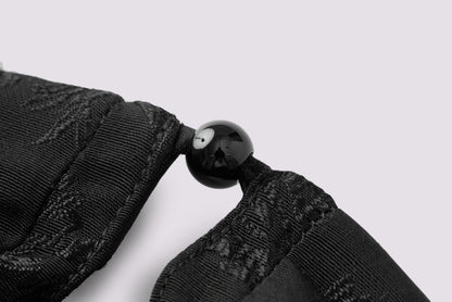 Schwarzes Jacquard-Neckholderkleid