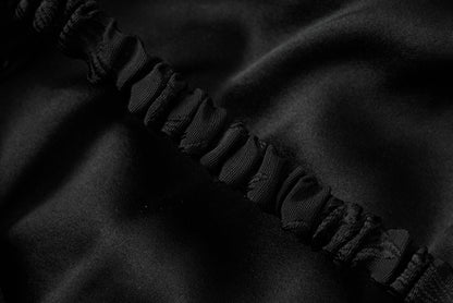 Schwarzes Jacquard-Neckholderkleid